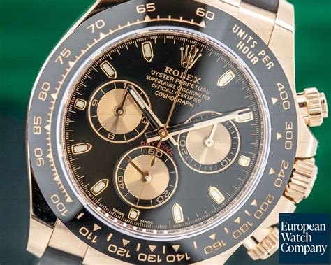 gold rolex daytona black face.